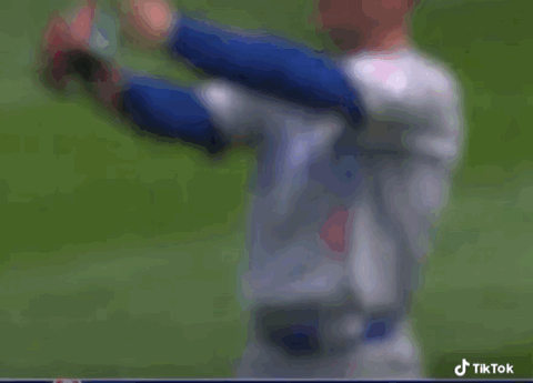 Man in Chicago Cubs Uniform on Baseball Field