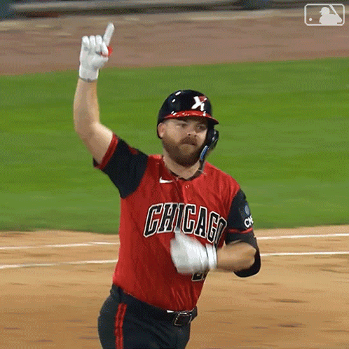 Man in Chicago Jersey Holding Up Glove