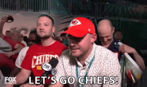 Man in Chiefs Hat Saying Let's Go Chiefs in Crowd