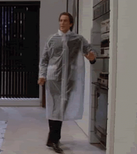 Man in Clear Raincoat Walking