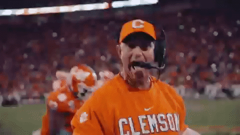 Man in Clemson Shirt and Hat on Football Field