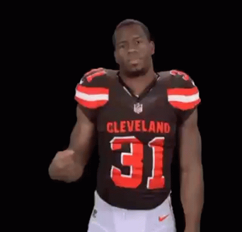 Man in Cleveland 31 Jersey Flexing Arm
