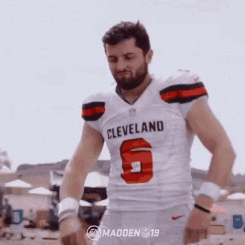 Man In Cleveland Browns Jersey On Beach GIF