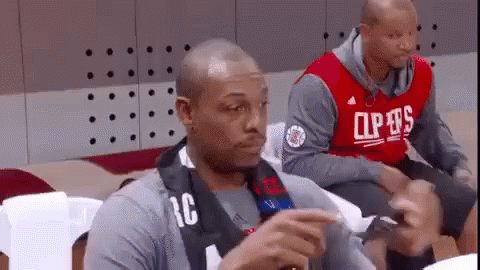Man in Clippers Jersey Sitting in Stadium