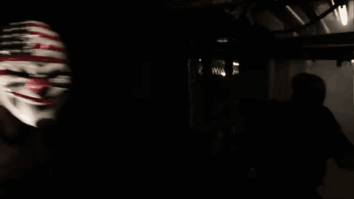 Man In Clown Mask With American Flag GIF