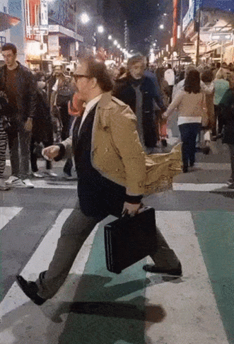 Man In Coat Walking Freeze GIF