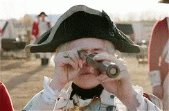 Man In Colonial Hat Looking Through Telescope GIF