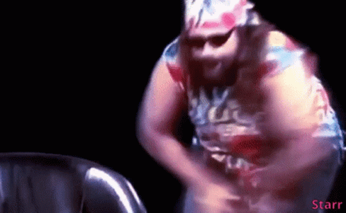 Man in Colorful Shirt Dancing in Dark Room with Word Starr