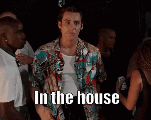 Man in Colorful Shirt in Crowd Saying In The House