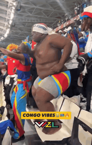 Man In Congo Headband Dancing In Crowd GIF