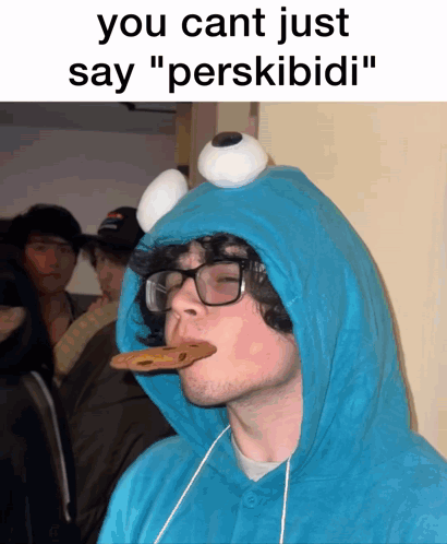 Man in Cookie Monster Costume Eating Cookie