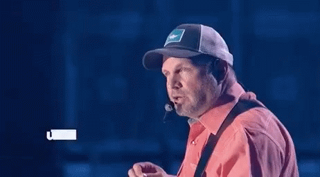 Man In Cowboy Hat And 3D Glasses Looking GIF