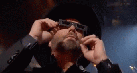 Man In Cowboy Hat And 3D Glasses Looking GIF