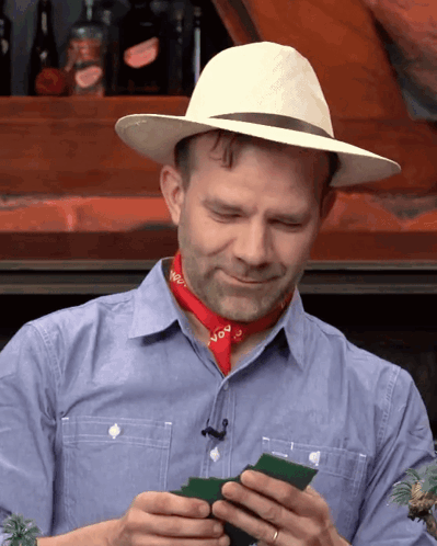 Man In Cowboy Hat And Bandana Saying NVO GIF