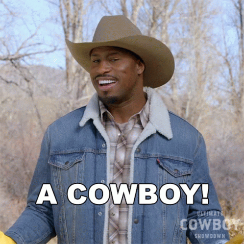 Man In Cowboy Hat And Denim Jacket Says A Cowboy GIF