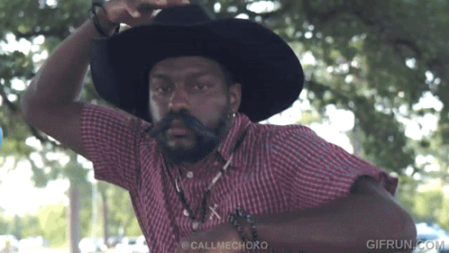 Man in Cowboy Hat and Plaid Shirt