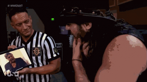 Man In Cowboy Hat And Referee Holding Self Pictures GIF