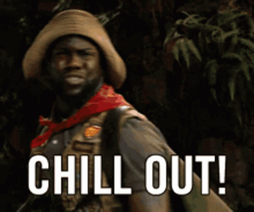 Man in Cowboy Hat and Scarf Says Chill Out
