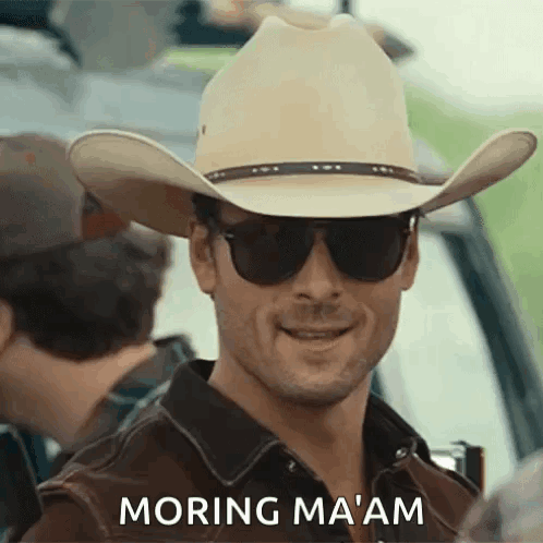 Man in Cowboy Hat and Sunglasses Saying Morning Ma'am