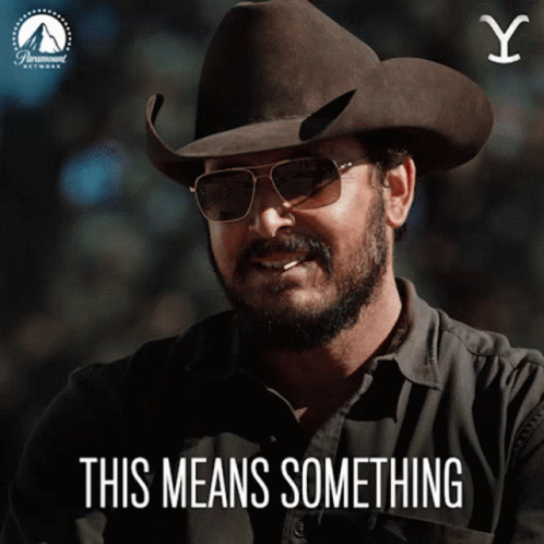 Man in Cowboy Hat and Sunglasses This Means Something
