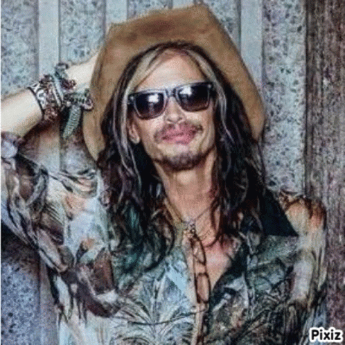 Man in Cowboy Hat and Sunglasses With Long Hair