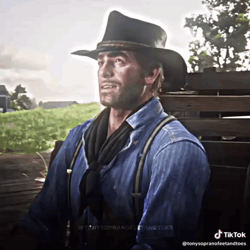 Man in Cowboy Hat and Suspenders