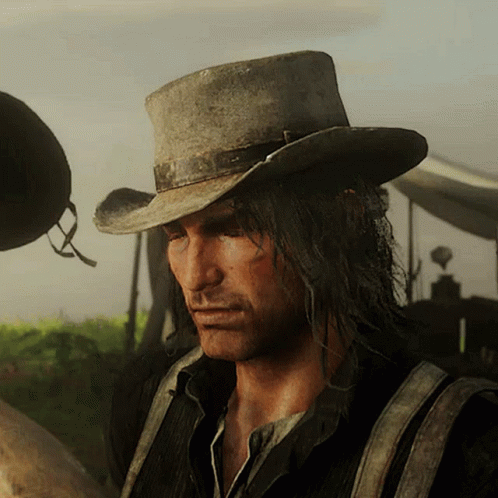 Man in Cowboy Hat and Suspenders Looking Down