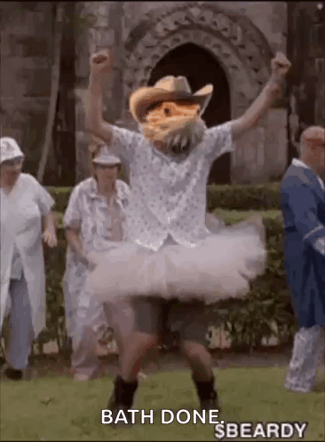 Man In Cowboy Hat And Tutu Dancing In Grass GIF