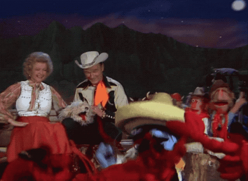 Man in Cowboy Hat and Woman in Sombrero Dancing