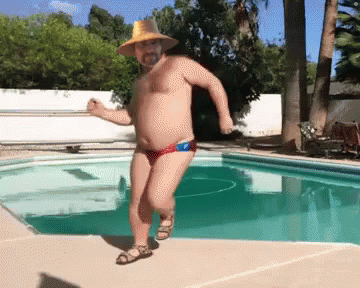 Man in Cowboy Hat Dancing by Pool
