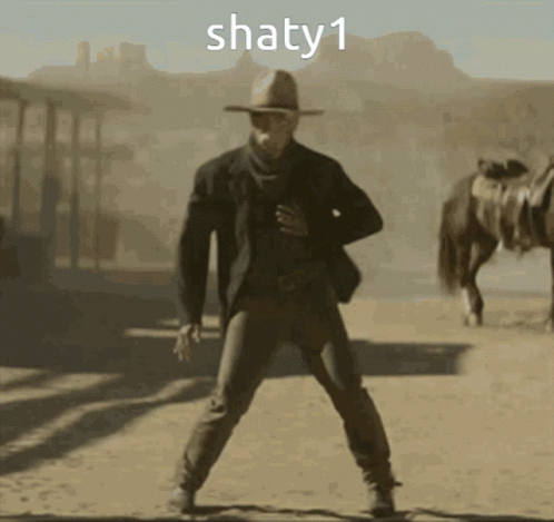 Man In Cowboy Hat Dancing In Desert With Horse And Text Shaty1 GIF