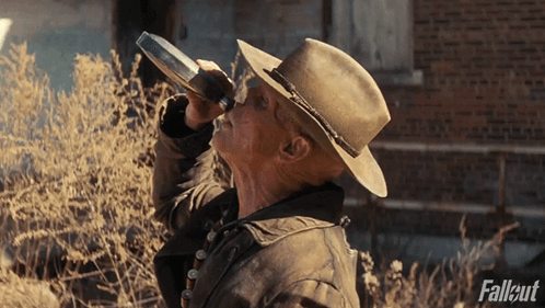 Man in Cowboy Hat Drinking Bottle Fallout