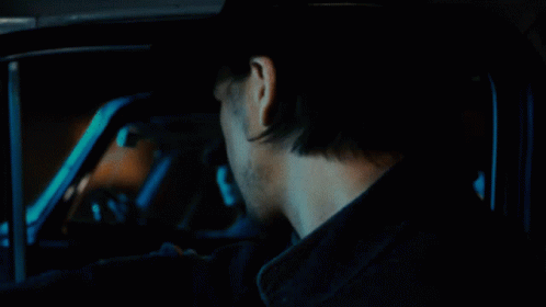 Man in Cowboy Hat Driving Car