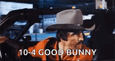 Man in Cowboy Hat Driving Car Saying 10-4 Good Bunny