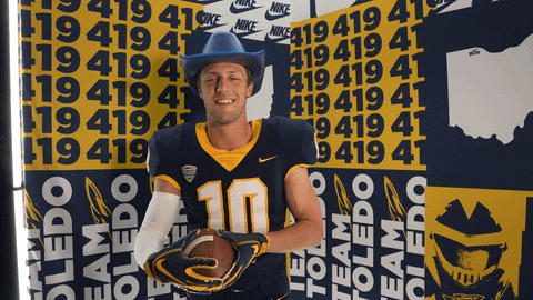 Man in Cowboy Hat Holding Football Toledo Team Wall