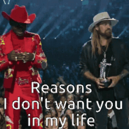 Man In Cowboy Hat Holding Sign Saying Reasons I Don't Want You In My Life GIF