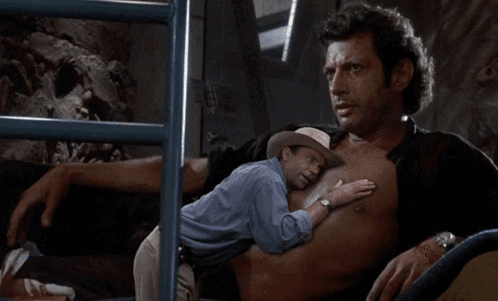 Man in Cowboy Hat Hugging Another