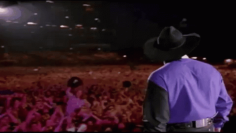 Man in Cowboy Hat in Front of Crowd