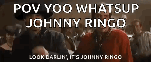 Man In Cowboy Hat Next To Man In Red Sweater GIF