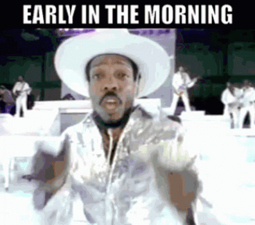 Man in Cowboy Hat on Stage Early Morning