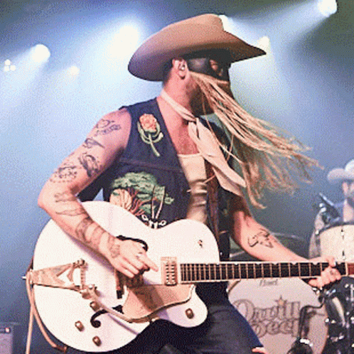 Man in Cowboy Hat Playing Guitar
