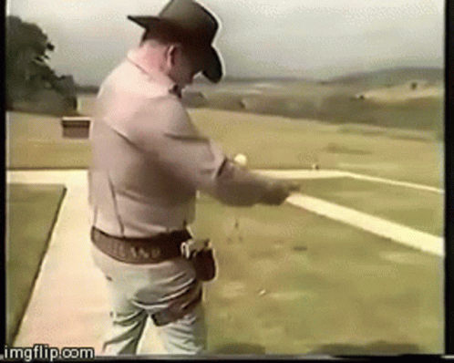 Man in Cowboy Hat Pointing Gun at Target