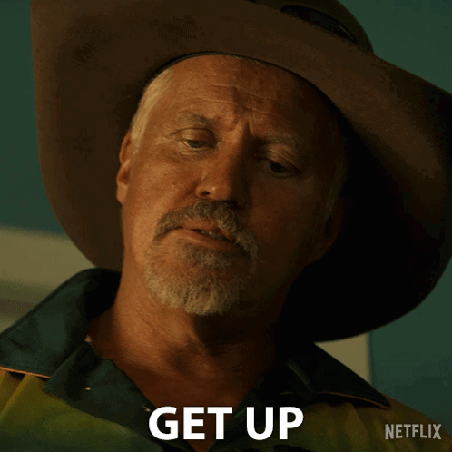 Man in Cowboy Hat Saying Get Up