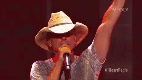 Man In Cowboy Hat Singing Into Microphone GIF