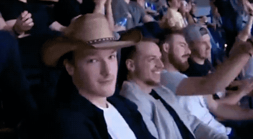 Man in Cowboy Hat Sitting