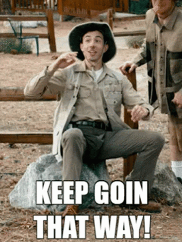 Man In Cowboy Hat Sitting On Rock Saying Keep Goin That Way GIF