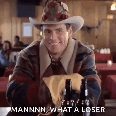 Man In Cowboy Hat Sitting With Beer Bottles GIF