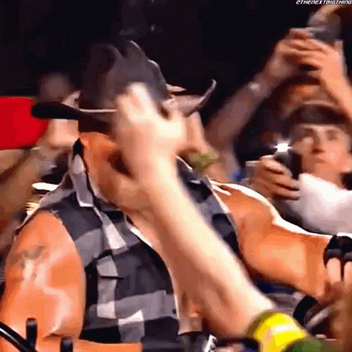 Man in Cowboy Hat Standing in Crowd
