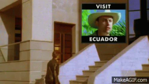 Man in Cowboy Hat Walking Down Stairs With Visit Ecuador Screen