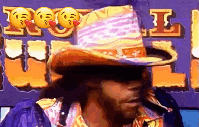 Man in Cowboy Hat with I Love You Sign